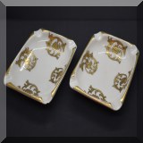 P60. 2 DeHauteville Porcelain gold and white ashtrays. 